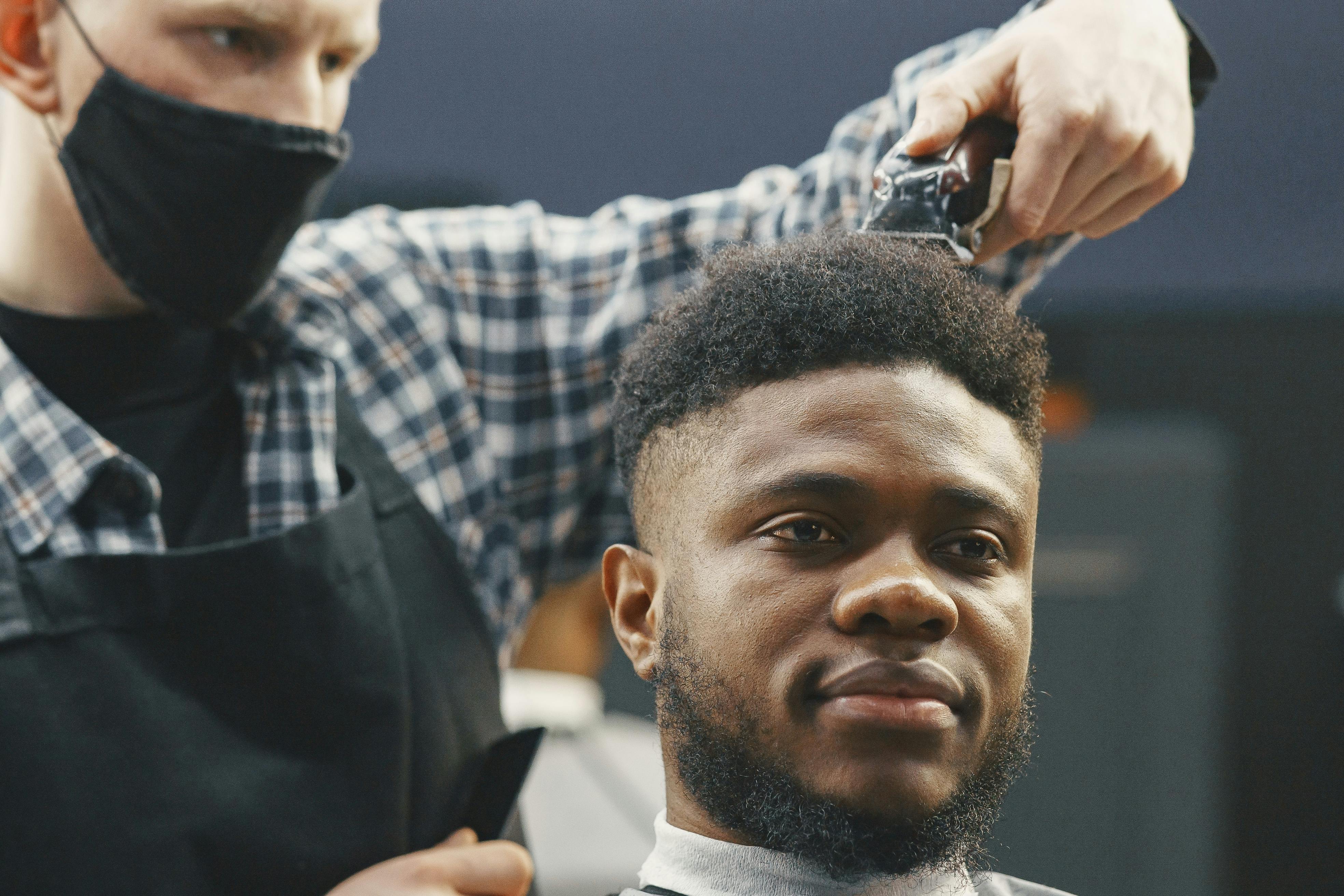 Barber at work inside Pulse Barbershop
